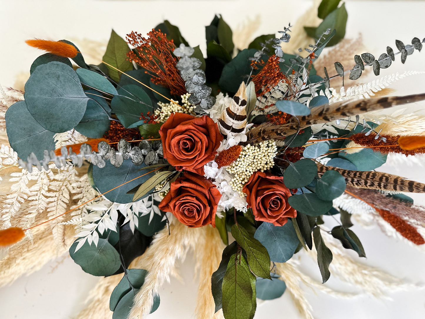 Rust + Eucalyptus Pheasant Feather Sweetheart Table Centerpiece