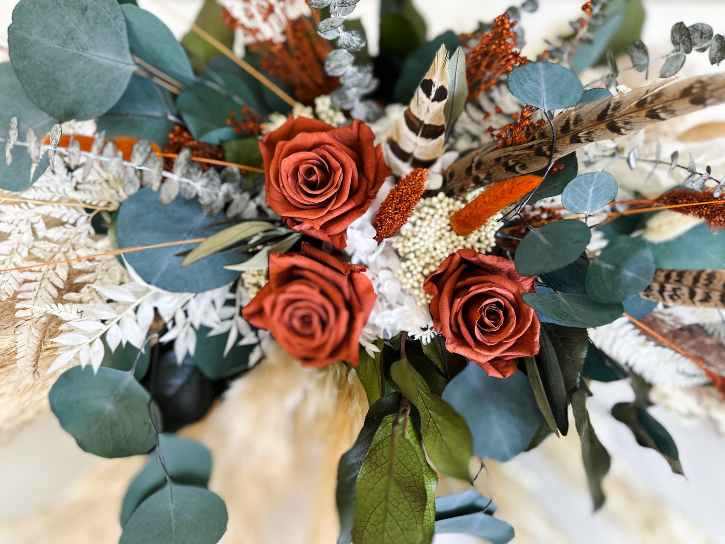 Rust + Eucalyptus Pheasant Feather Sweetheart Table Centerpiece